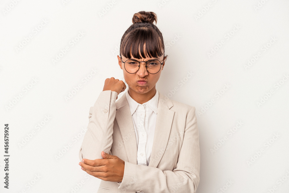 Young mixed race woman isolated on white background having a neck pain due to stress, massaging and touching it with hand. Young mixed race woman isolated on white background having a neck pain due to stress, massaging and touching it with hand.