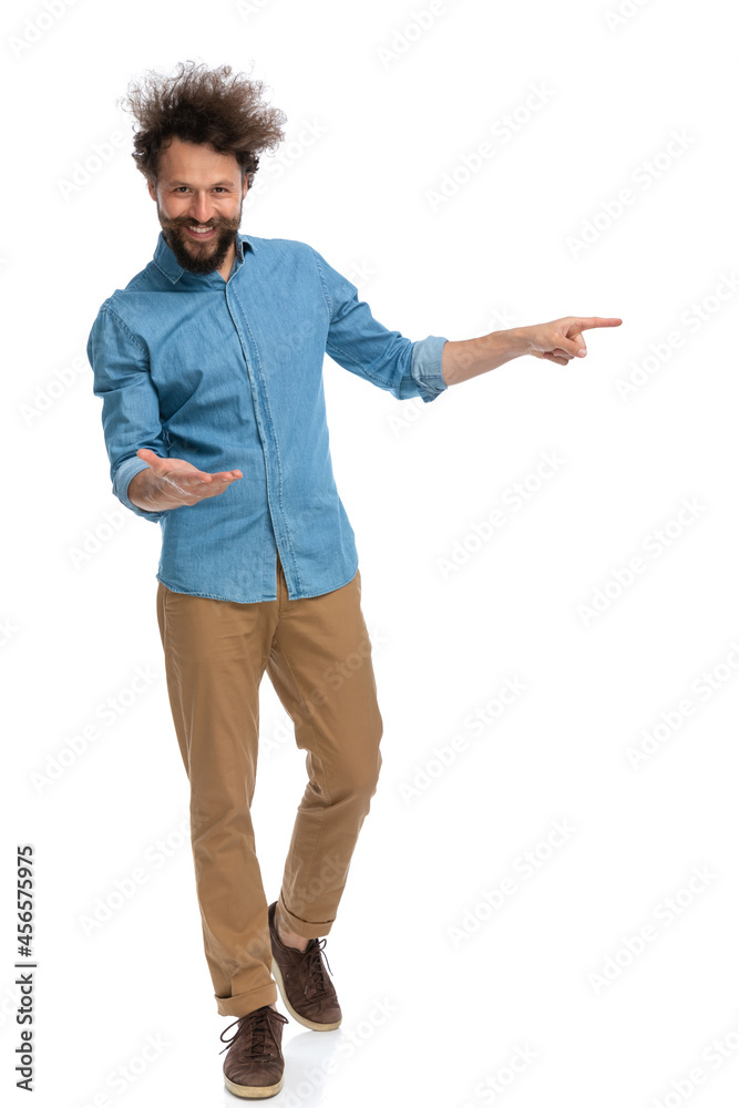 casual man greeting someone then pointing to the side casual man greeting someone then pointing to the side