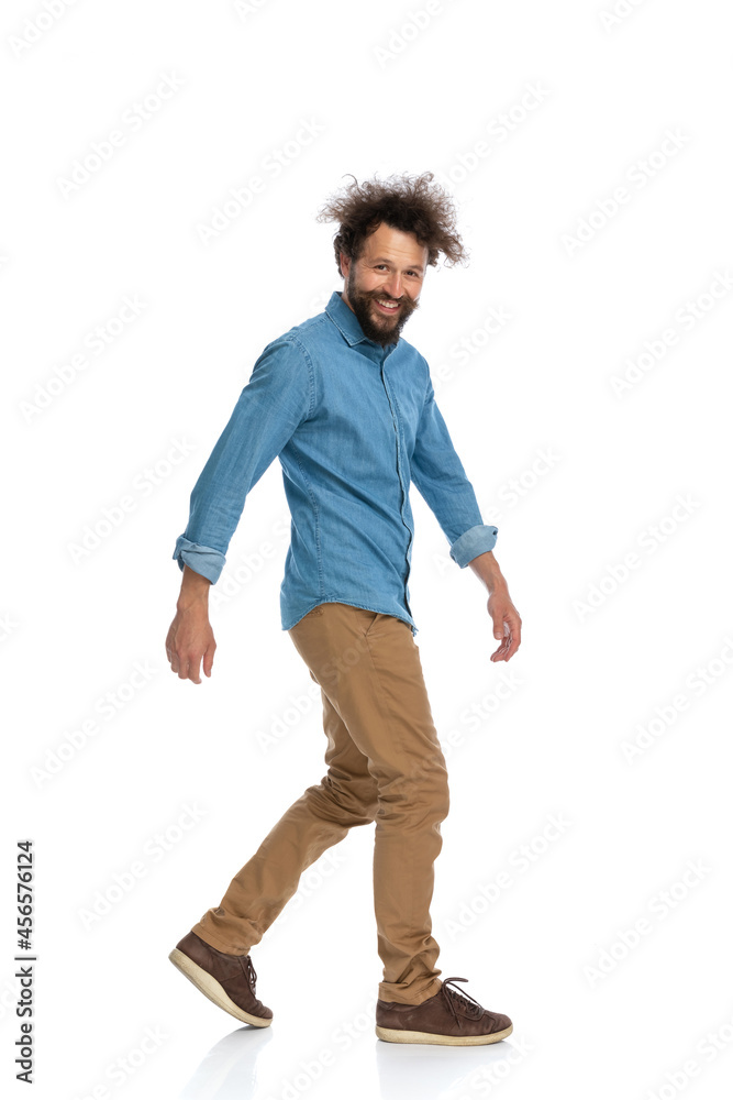 casual man walking to the side casual man walking to the side