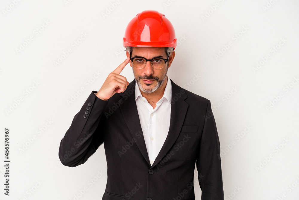Middle age architect caucasian man isolated on white background pointing temple with finger, thinking, focused on a task. Middle age architect caucasian man isolated on white background pointing temple with finger, thinking, focused on a task.
