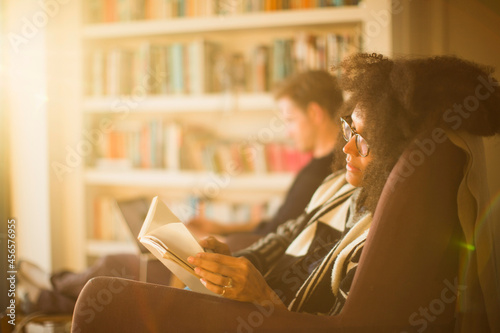 Couple reading at home, Tokavaig, Isle of Skye, Scotland photo