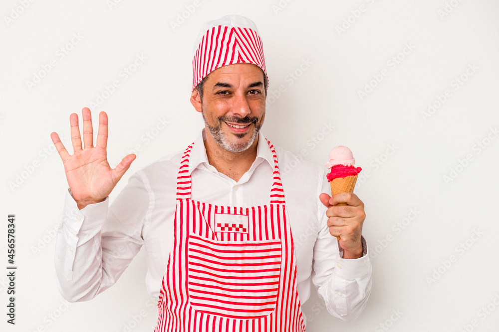 Middle age caucasian ice maker caucasian man holding an ice cream isolated on white background smiling cheerful showing number five with fingers. Middle age caucasian ice maker caucasian man holding an ice cream isolated on white background smiling cheerful showing number five with fingers.