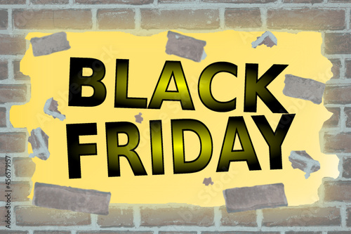 The inscription BLACK FRIDAY breaks the brick wall	