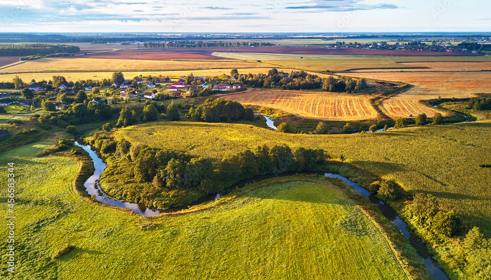 September agriculture fields aerial panorama. Sunny autumn landscape. Farmland Corn harvest