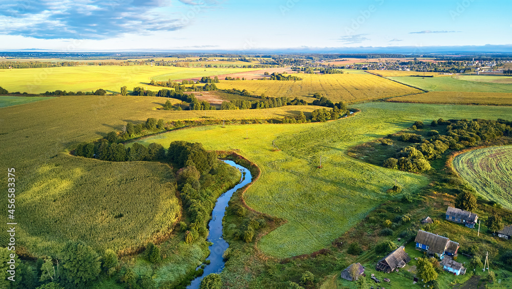 September agriculture fields aerial panorama. Sunny autumn landscape. Farmland Corn harvest.