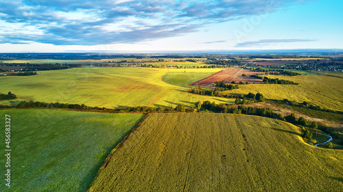 September agriculture fields aerial panorama. Sunny autumn landscape.