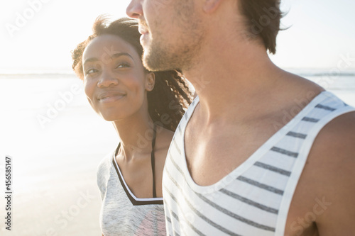 Fotografi Romantic young woman gazing at boyfriend on beach, Cape Town, Western Cape, Sout