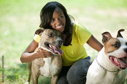 Canvas Print Woman with her pet dogs