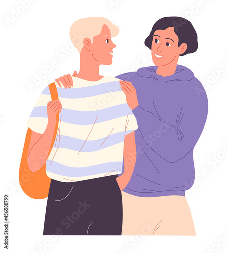 Two boys are walking and one put his arm around the shoulders of the other
