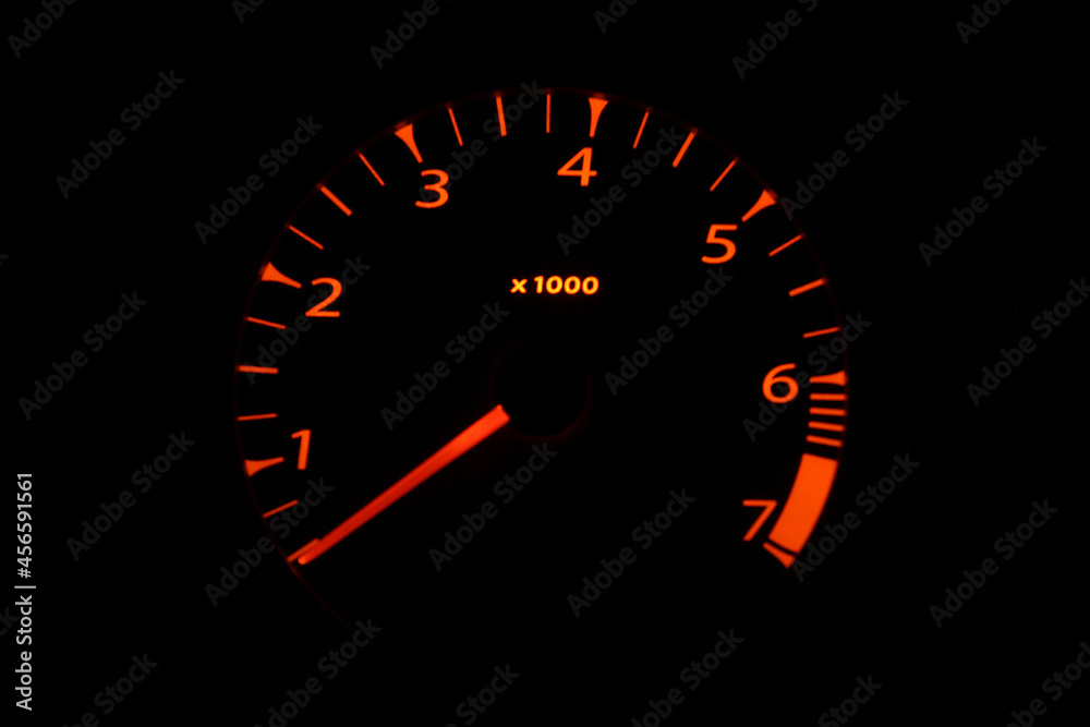 Car tachometer with orange scale on black background Car tachometer with orange scale on black background