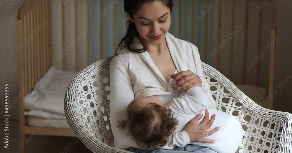 Video Stock Infant daughter eats mothers milk calms down and falls