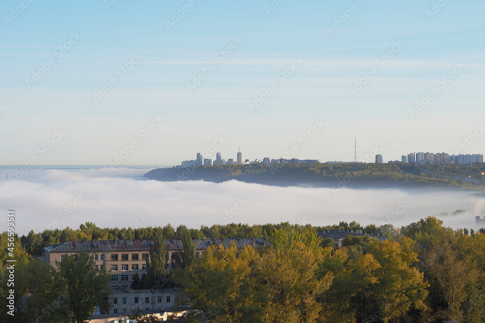 Morning fog over the city and the river.