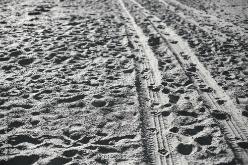 footprints in the sand, black and white 