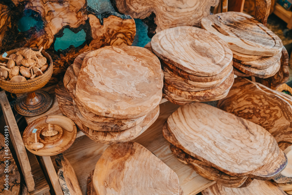 Products made from olive tree, wooden souvenirs on sale in Greece island - Corfu. Local market with craft kitchen accessories - cutting board, spoons