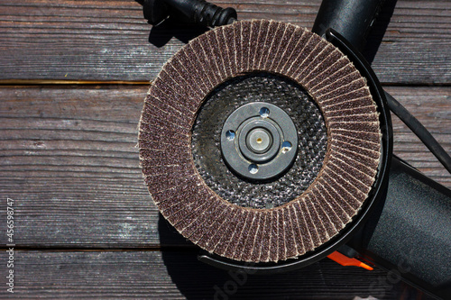 Abrasive wheel for a grinder. Angle grinder. Hand tool for grinding. Electric tool.