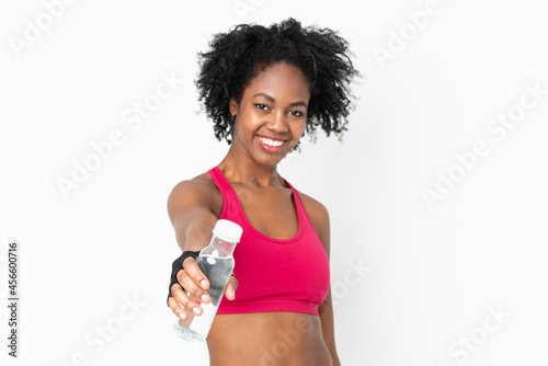 Young African American woman isolated on white background with sports water bottle