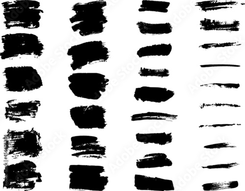 collection of black grunge drop AND spots and brush strokes of different shapes isolated on white in vector for web banner