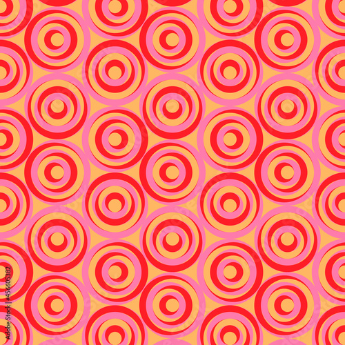 Red and pink circles on orange color background. Brick tile geometric vector pattern. 70-s fashion style artwork can be used for fabrics  wallpapers  diaries  wrapping  flyers  posters and decoration.