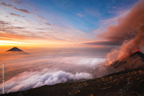 Volcano Erupting above sea of clouds in Guatemala eruption sunrise