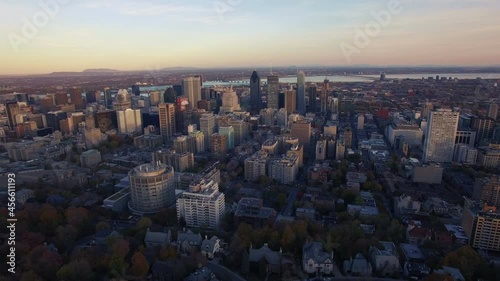 4K aerial drone shot of montreal skyline high forward move at sunset
