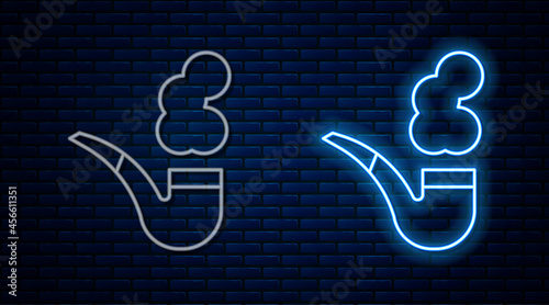 Glowing neon line Smoking pipe with smoke icon isolated on brick wall background. Tobacco pipe. Vector