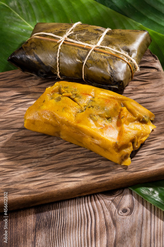 Tamale Typical Colombian Food Wrapped In Banana Leaves photo