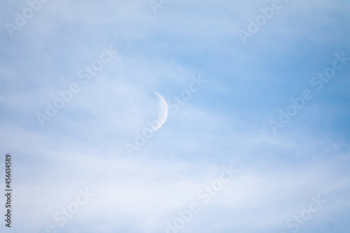 Cirrus clouds covering the crescent moon