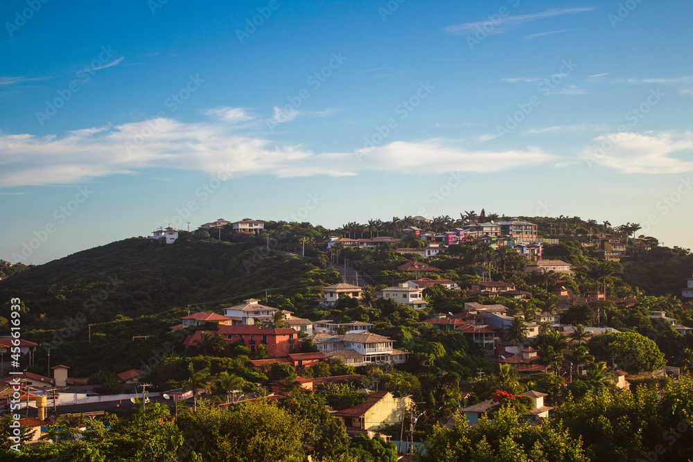 Panoramic view of houses in Buzios, mountain, blue sky, sunny day, near Rio de Janeiro, Brazil.