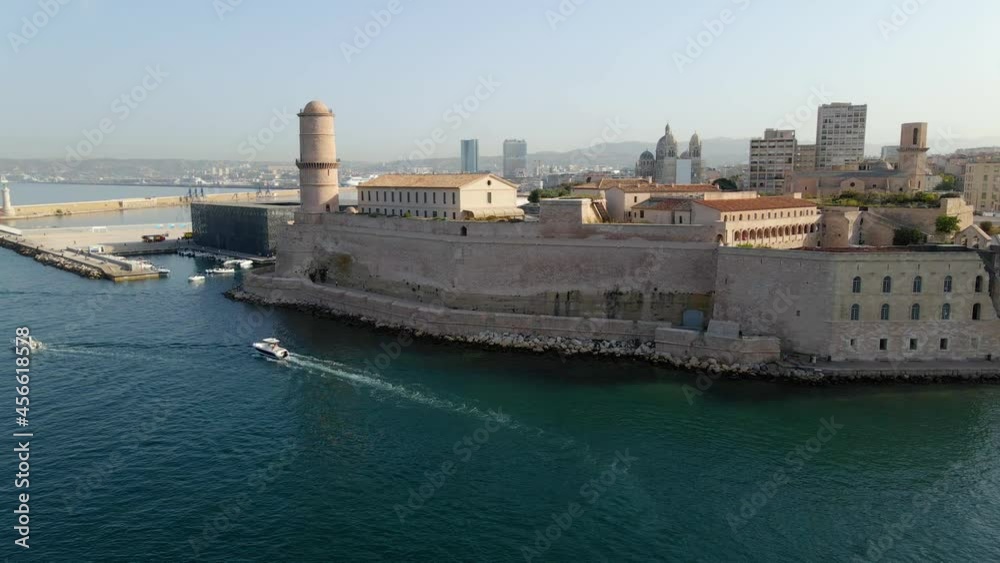 Aerial drone view over boats and buildings, at the port of Marseille, sunrise in France Aerial drone view over boats and buildings, at the port of Marseille, sunrise in France