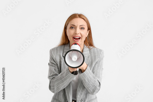 Mature woman shouting into ...