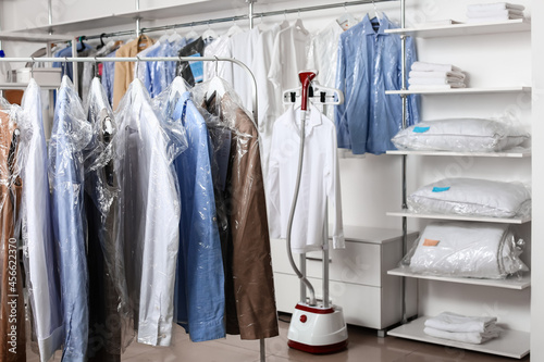 Rack with clothes at modern...