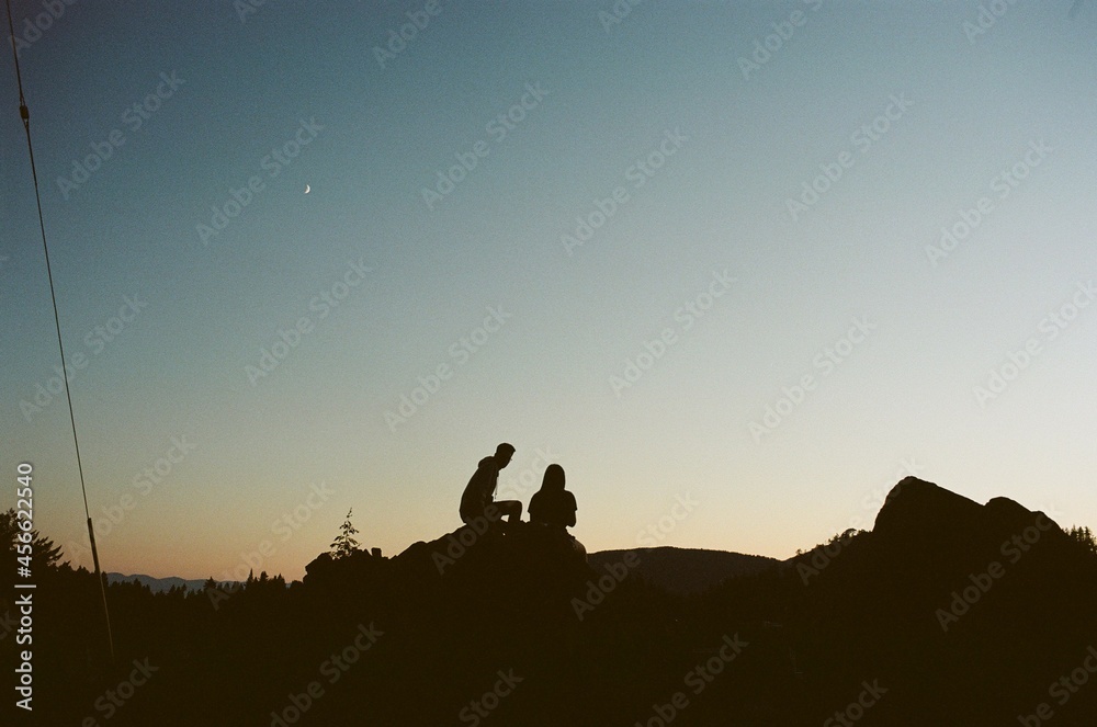 silhouette of a couple who were sunset gazing