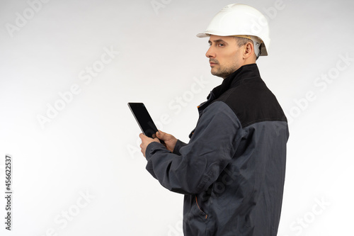 Worker with a smartphone in...