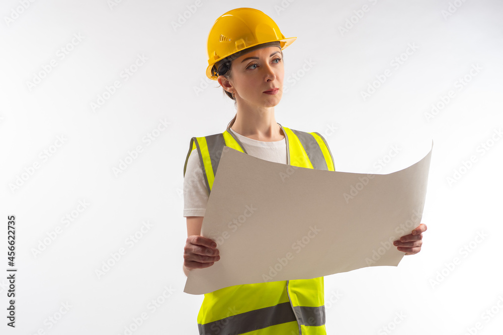 Woman architect. Architect in construction uniform. Sheet of paper in hands of builder. Portrait architect on white background. Young girl builder. Employee of architectural bureau. Engineer career Woman architect. Architect in construction uniform. Sheet of paper in hands of builder. Portrait architect on white background. Young girl builder. Employee of architectural bureau. Engineer career