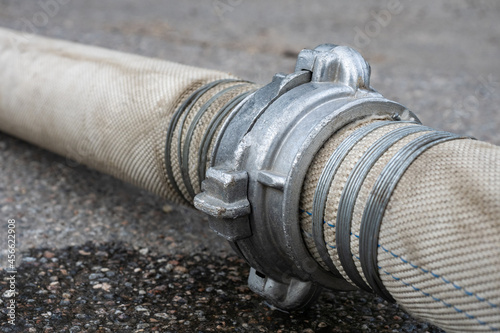Cloth hose with metal tie. ...