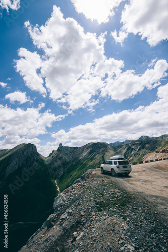 Driving off road car on high altitude mountain cliff edge © lzf