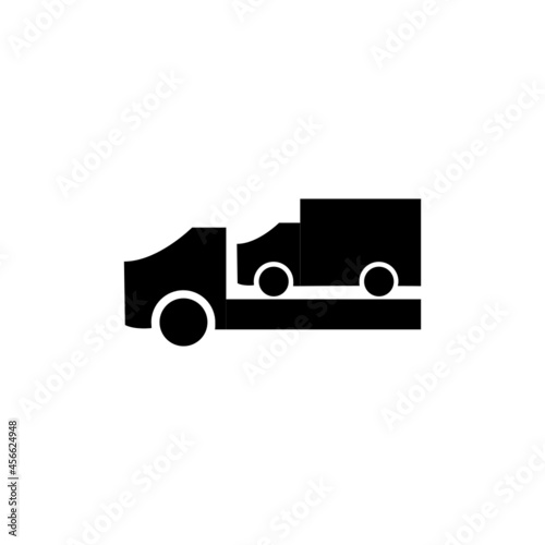 Car on heavyweight freight lorry truck. Car mover black and white vector icon. photo