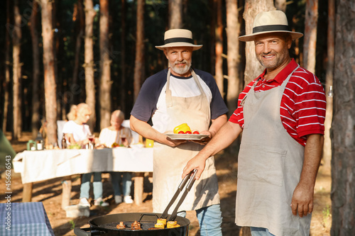 Mature man cooking food on ...