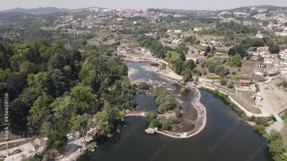 Tamega river flowing near majestic town of Amarante, aerial drone view Tamega river flowing near majestic town of Amarante, aerial drone view