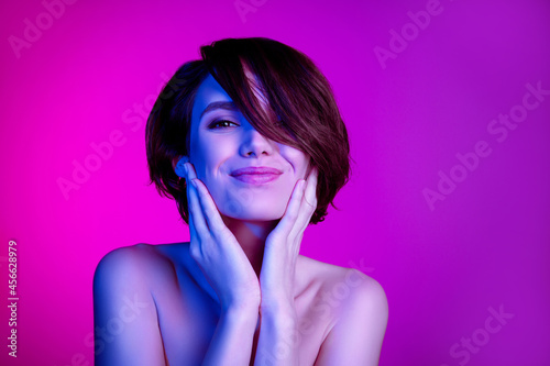 Portrait of attractive cheery girl touching flawless shine smooth skin vitality isolated over bright lilac multicolor color background