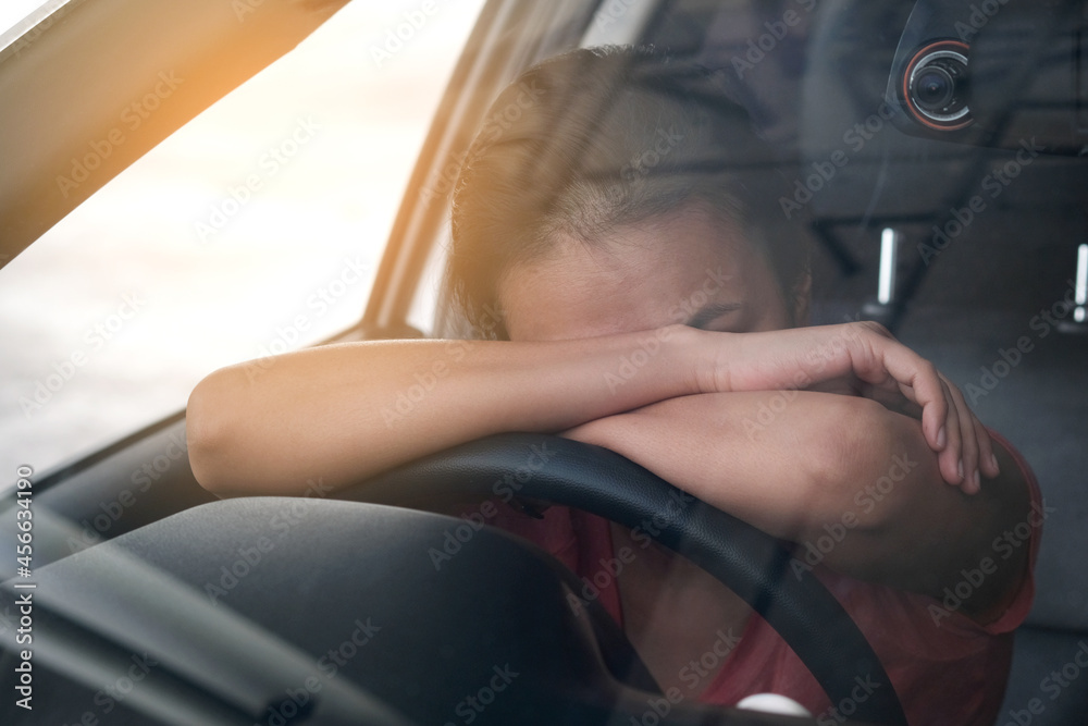 Sleepy woman While she was driving on the road. Concept of health and driving safety Sleepy woman While she was driving on the road. Concept of health and driving safety