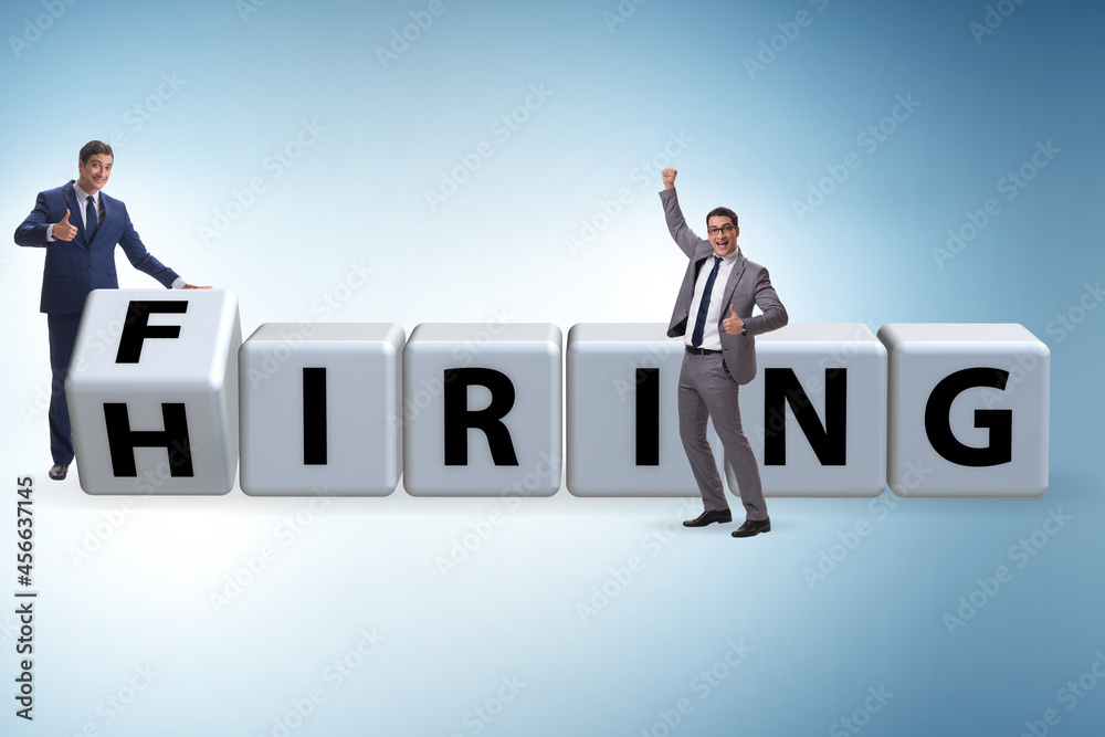 Hiring and firing concept with turning cubes Hiring and firing concept with turning cubes