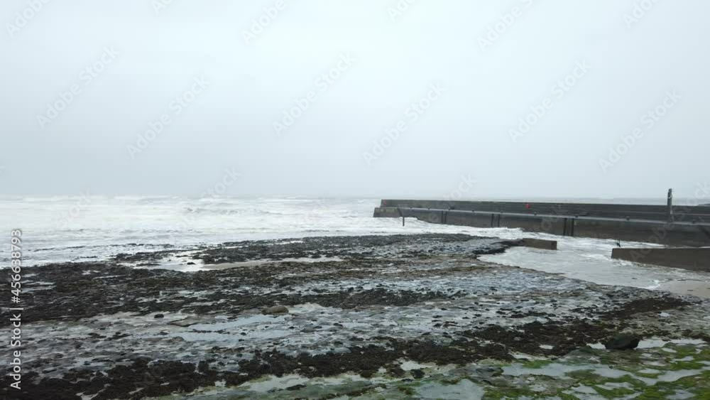 Waves crashing on Enniscrone Pier during a storm, Enniscrone, Co Sligo, Ireland Waves crashing on Enniscrone Pier during a storm, Enniscrone, Co Sligo, Ireland