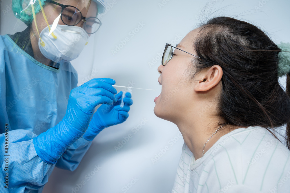 Healthcare worker trying to do oral (throat) swab by collect a sample