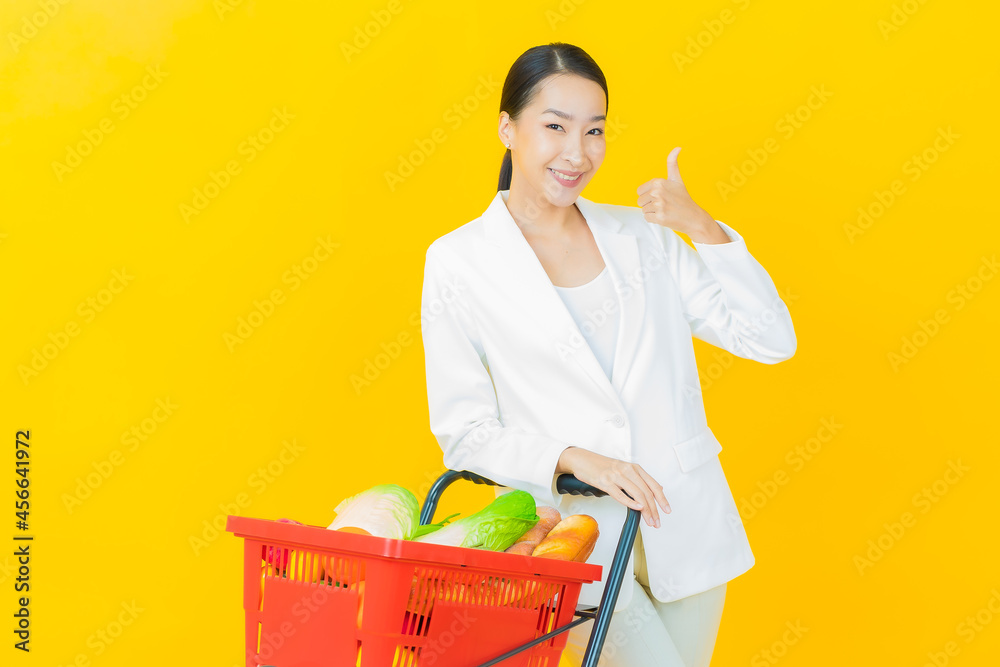 Portrait beautiful young asian woman smile with grocery basket Portrait beautiful young asian woman smile with grocery basket