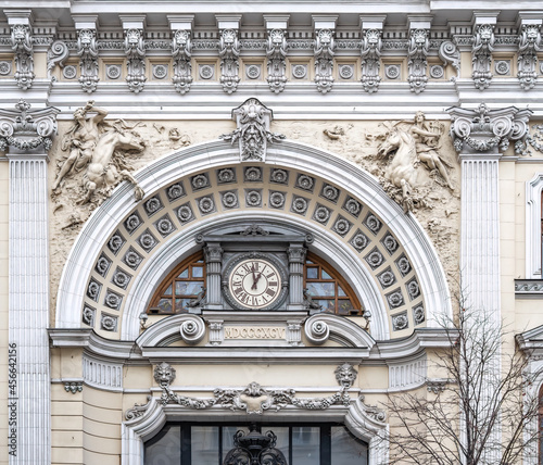 Luxurious building in the Baroque style, Firsanova's apartment house, Neglinnaya street 14, Moscow, Russia. Facade of a 18th century building with gate, clock and stucco decoration.