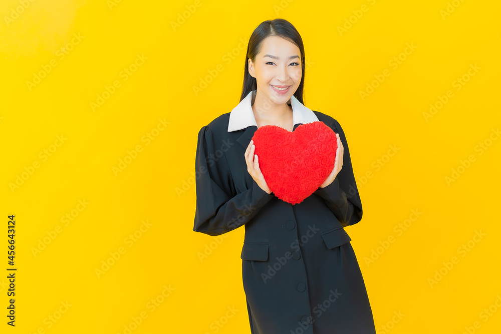 Portrait beautiful young asian woman smile with heart pillow shape Portrait beautiful young asian woman smile with heart pillow shape