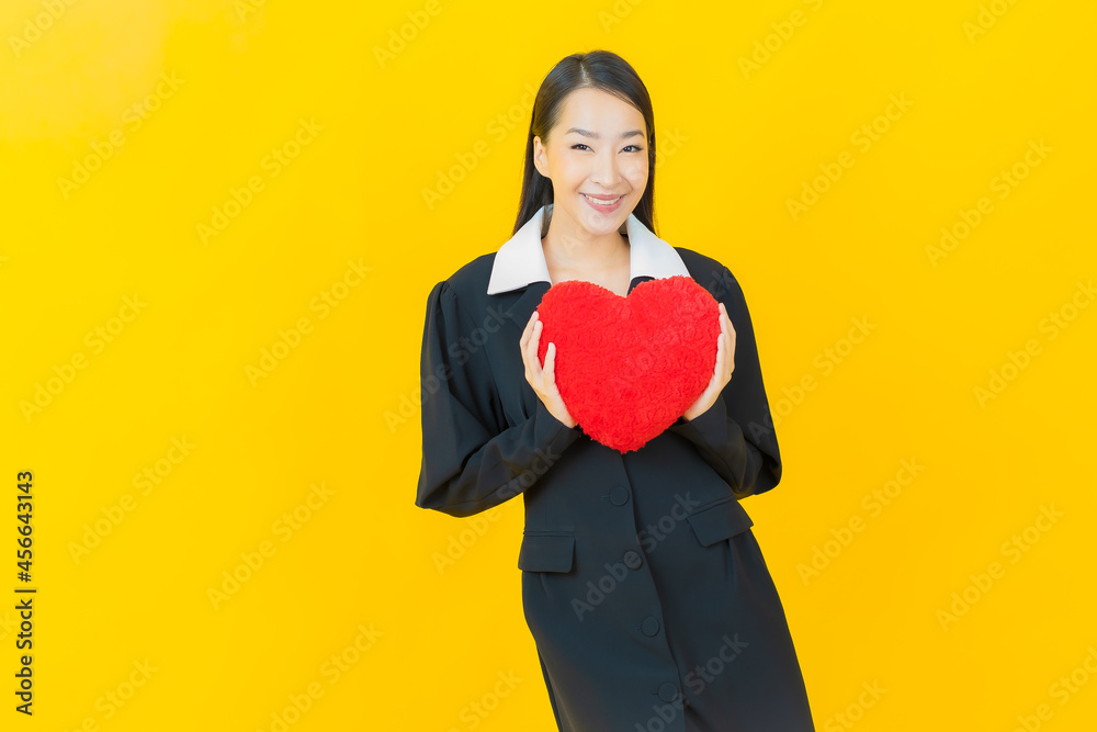Portrait beautiful young asian woman smile with heart pillow shape Portrait beautiful young asian woman smile with heart pillow shape