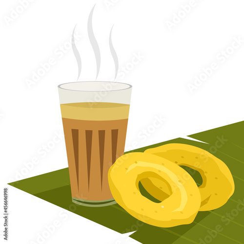 South Indian style tea with vada on banana leaf