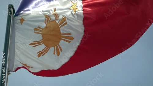 The Philippine Flag, Pambansang Watawat flying in the wind. photo